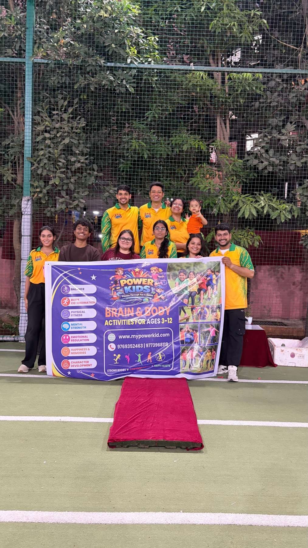 Power Kids team with banner